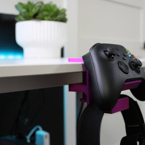 Univerzální upínací držák pro ovladač a náhlavní soupravu